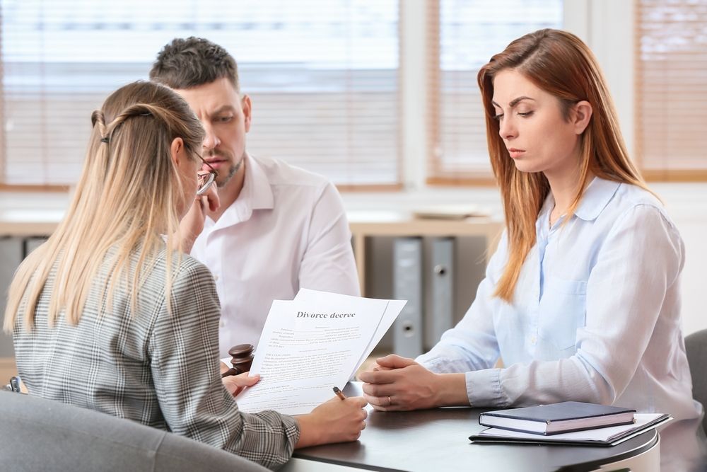 Couple with family lawyer discussing child custody case